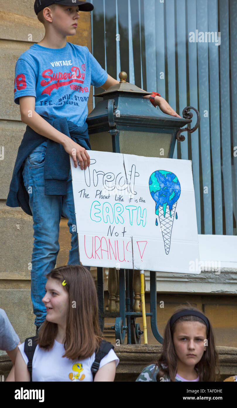 Bournemouth, Dorset, UK. 24th May 2019. Youth Strike 4 Climate gather in Bournemouth Square with their messages about climate change, before marching to the Town Hall.  Treat the planet like it is the Earth not Uranus sign. Credit: Carolyn Jenkins/Alamy Live News Stock Photo