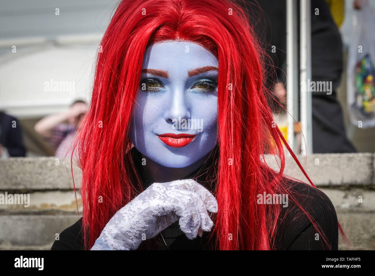 ExCel London, UK - 24th May 2019. Mystique from X-Men has gone all blue in the face. Thousands of cosplayers, gamers and lovers of film and TV fantasy and sci fi in costumes come together on the opening day of MCM Comicon at ExCel London. Credit: Imageplotter/Alamy Live News Stock Photo