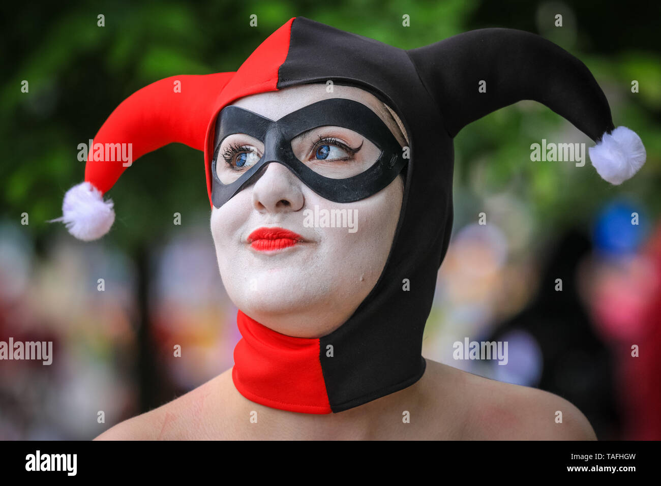 ExCel London, UK - 24th May 2019. A young woman dressed as Harley Quinn from Batman. Thousands of cosplayers, gamers and lovers of film and TV fantasy and sci fi in costumes come together on the opening day of MCM Comicon at ExCel London. Credit: Imageplotter/Alamy Live News Stock Photo