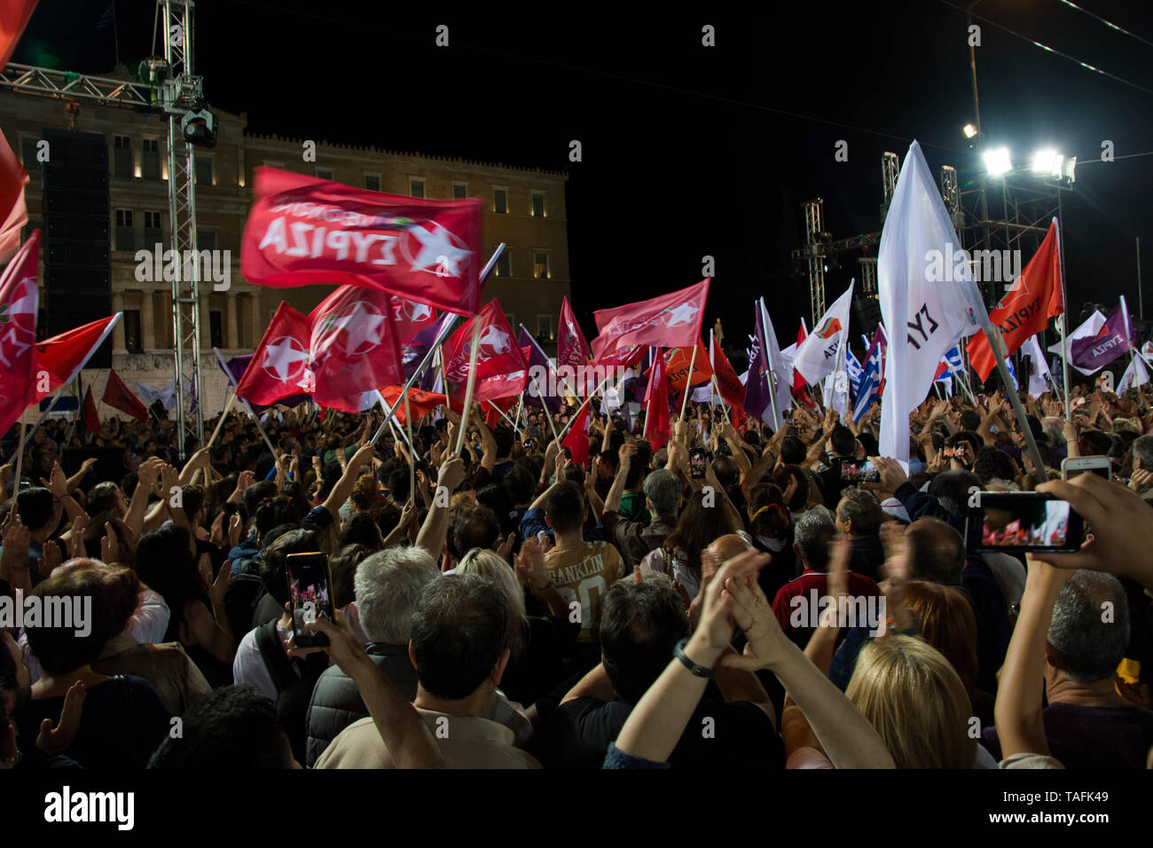 Athens, Greece. 24th May 2019. SYRIZA supporters wave flags as they attend the speech of their party leader, Alexis Tsipras. A few thousands gathered in front of the parliament for the party’s main pre-election rally as they will vote for European Parliament and municipalities on May 26th. © Nikolas Georgiou / Alamy Live News Stock Photo