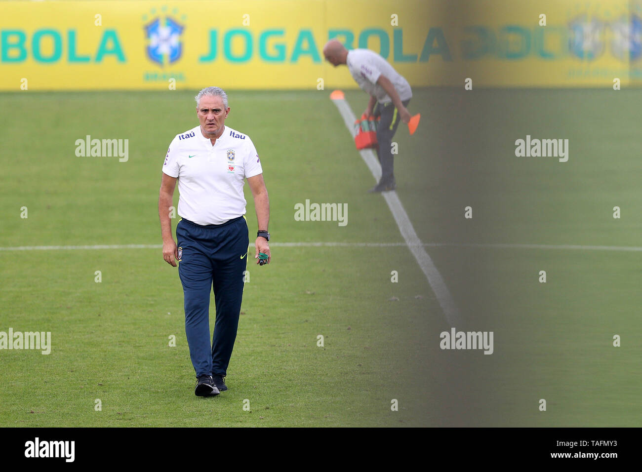 Teresopolis, Brazil. 24th May, 2019. Head coach Tite walks on the pitch during a training session of the Brazilian national soccer team ahead of the Copa America 2019 football tournament in Teresopolis, the state of Rio de Janeiro, Brazil, on May 24, 2019. Credit: Li Ming/Xinhua/Alamy Live News Stock Photo