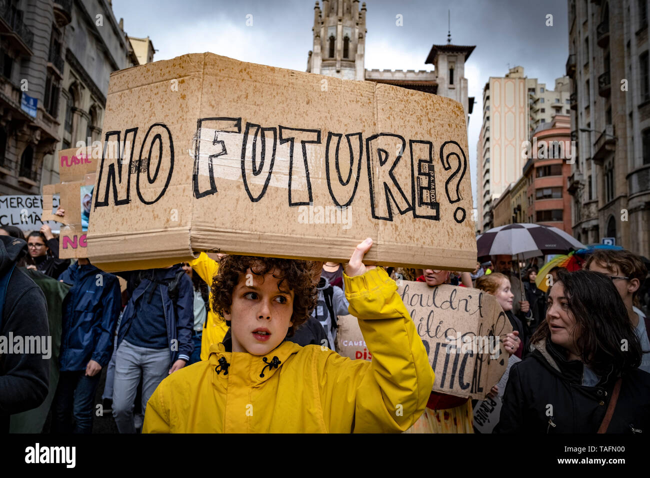 A protester is seen holding a placard that says no future during the strike. Hundreds of protesters, mostly teenagers, have demonstrated in Barcelona ending the tour in front of the government palace where they have read the manifesto calling for urgent measures against climate change. The strike for the climate Fridays for future was inspired by a young teenager and Swedish activist Greta Thunberg, is seconded in almost 1,500 cities in 114 countries. Stock Photo