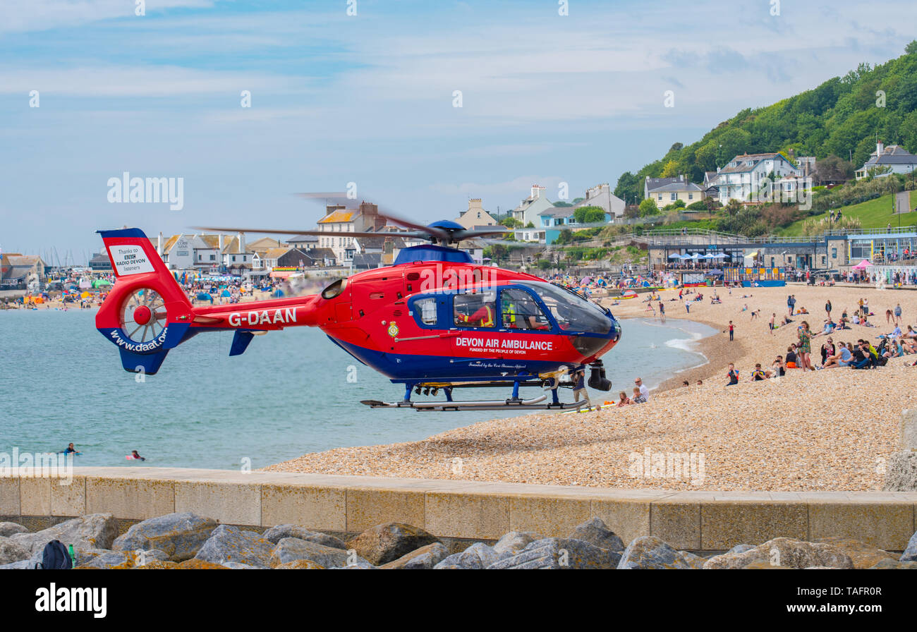 Lyme Regis, Dorset, UK. 25th May 2019. Devon Air Ambulance helicopter