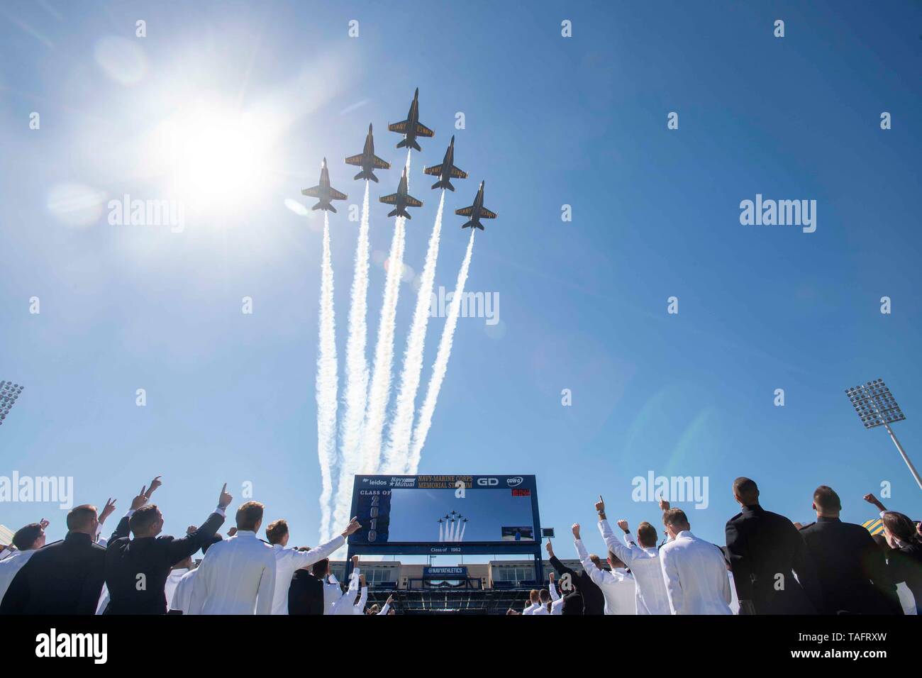 Annapolis, United States Of America. 24th May, 2019. The U.S. Navy Flight Demonstration Squadron, the Blue Angels, fly in formation over over Naval Academy graduates following the 2019 graduation and commissioning ceremony in the Navy-Marine Corps Memorial Stadium May 24, 2019 in Annapolis, Maryland. Credit: Planetpix/Alamy Live News Stock Photo