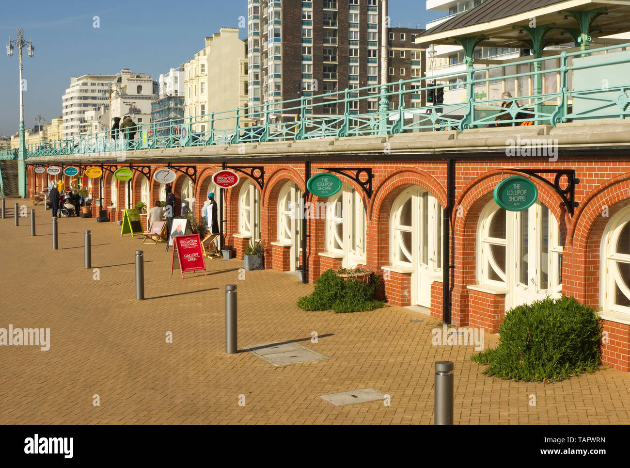 Small shops on the seafront promenade at Brighton, East Sussex, England