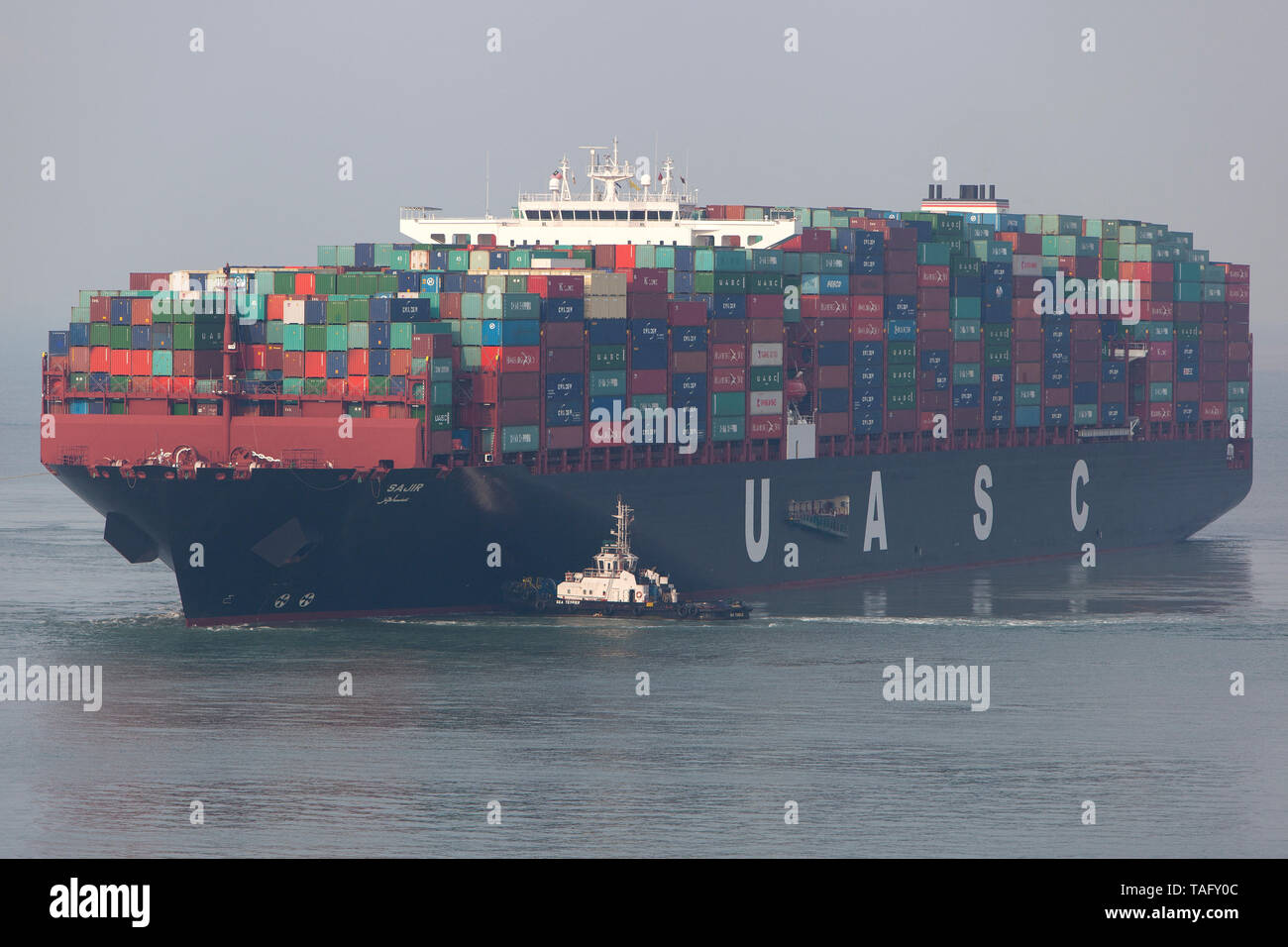 Container ships and tugs, Port Kelang, Malaysia Stock Photo Alamy