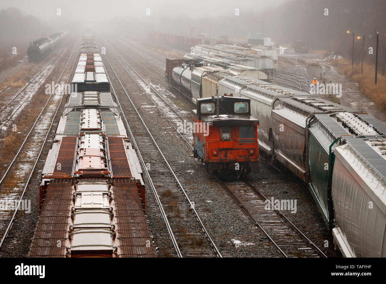 View of rail yard on a wet and foggy day. Stock Photo