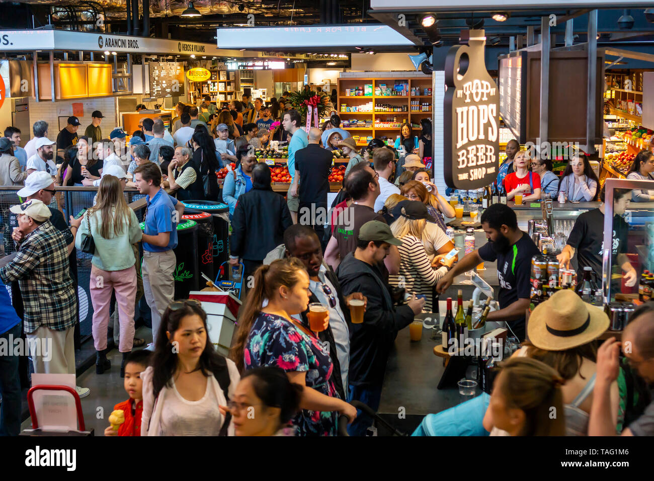 Hundreds of foodies crowd and queue up the newly opened Essex Market in