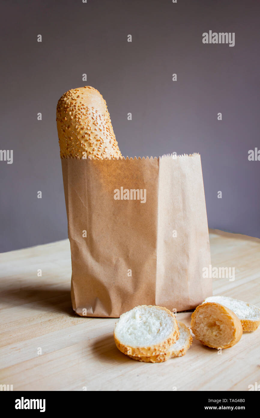 Slice of bread. White bread. Bread in a paper bag on the general ...