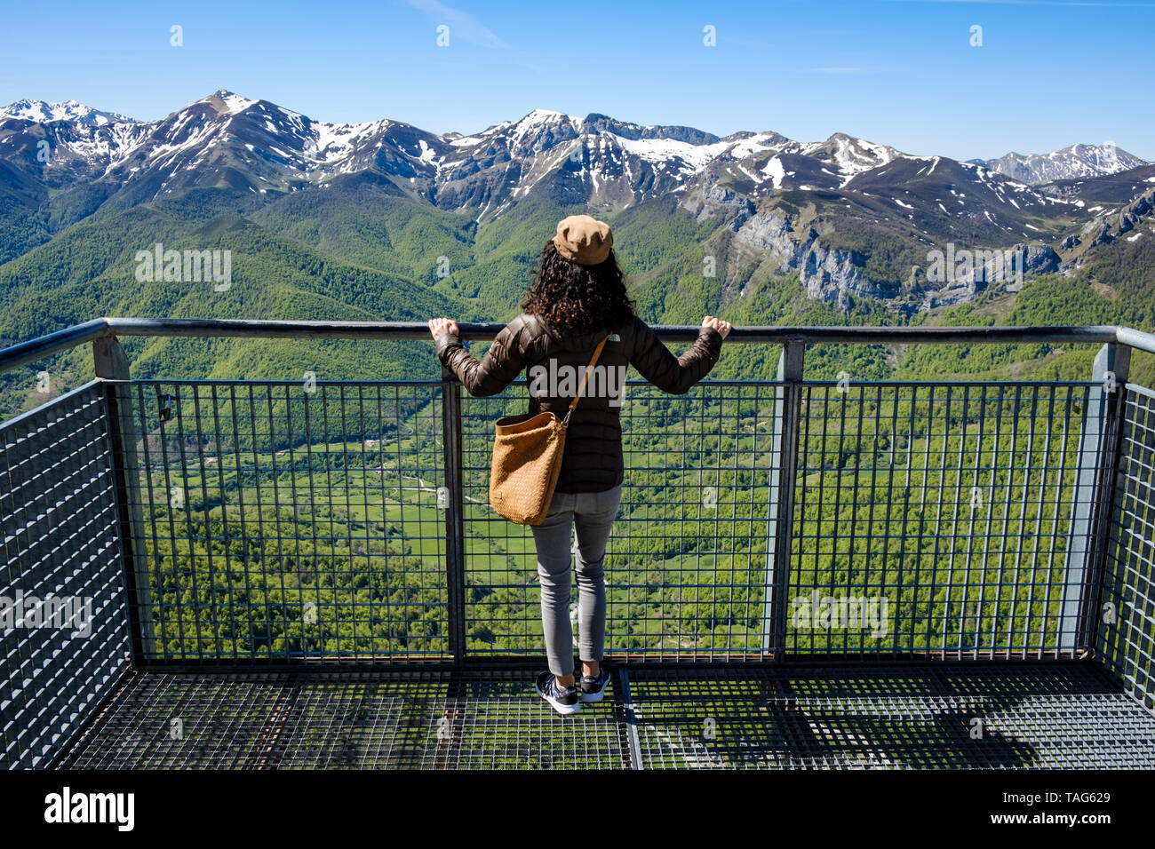 Young Woman Enjoying A Breathtaking View Of Picos De Europa From The Hanging Balcony Viewpoint At El Cable Station Cantabria Spain Stock Photo Alamy