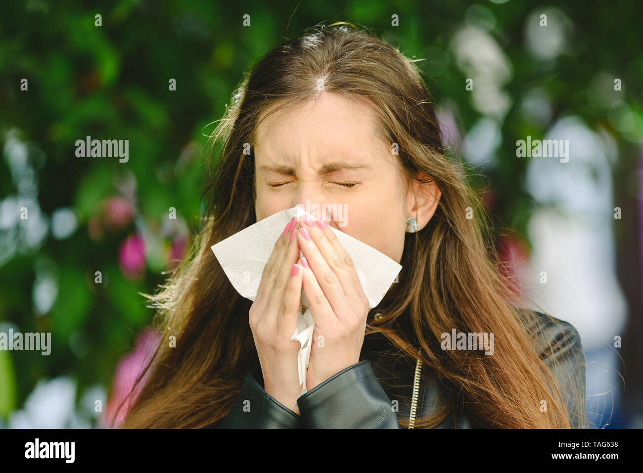 Young millennial sick woman sneeze holding tissue handkerchief and blowing wiping her running