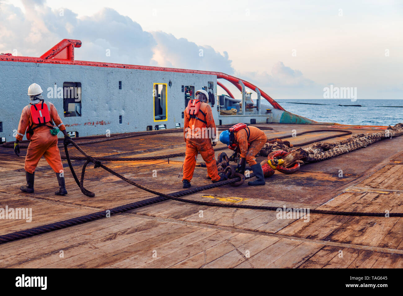 Vessel crew preparing vessel for static tow tanker lifting Stock Photo