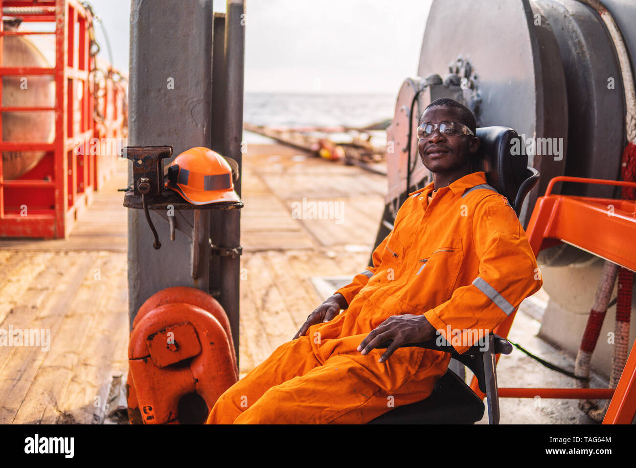 happy Seaman AB or Bosun on deck of vessel or ship Stock Photo