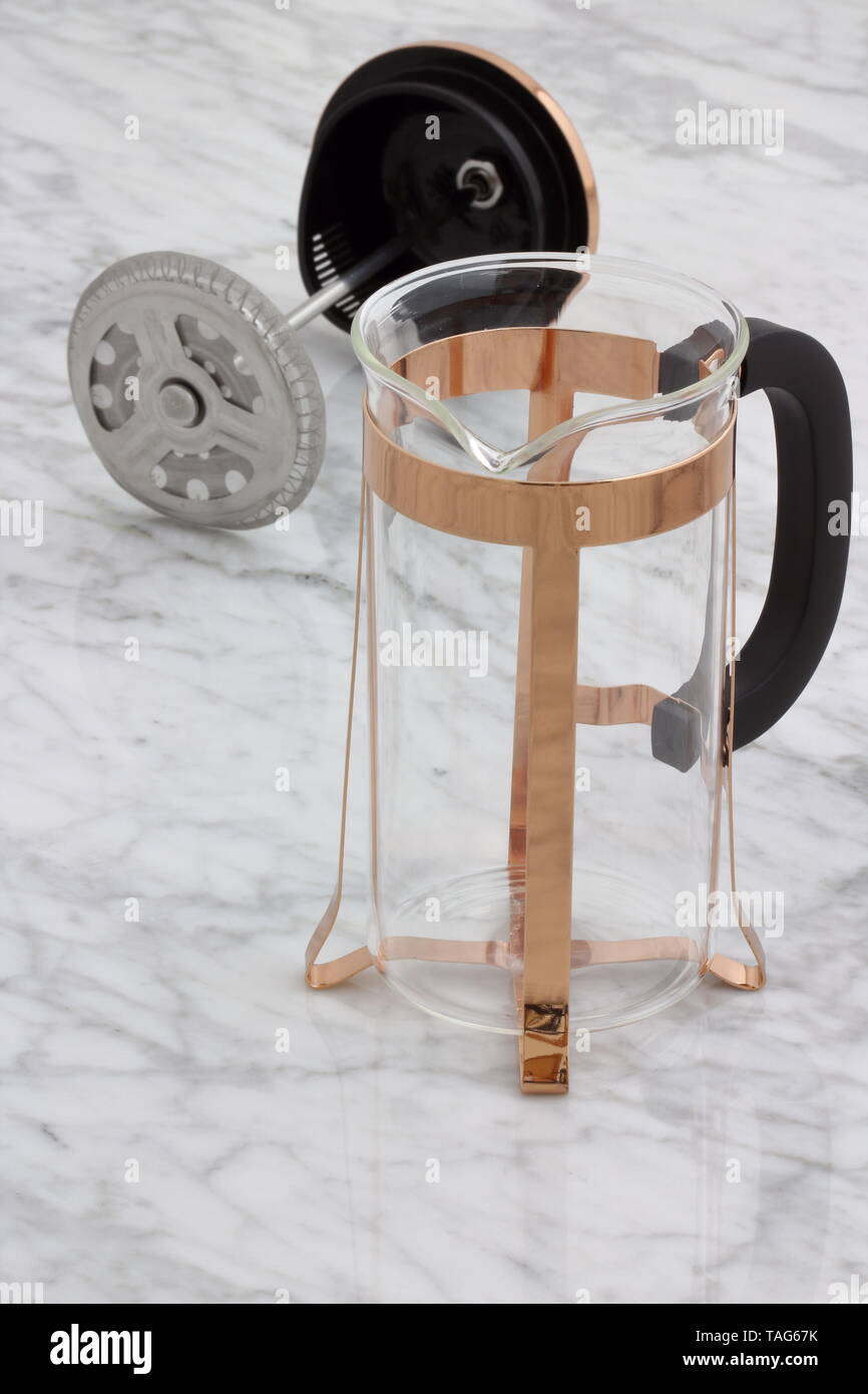 trendy and beautiful copper french press styled on carrara marble table