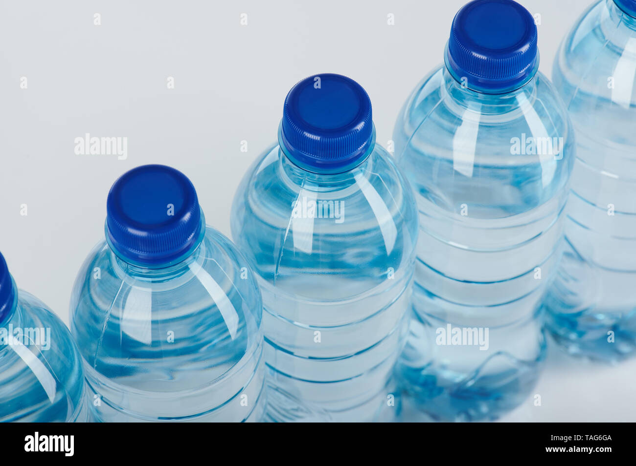 Plastic pollution theme. Blue water plastic bottles Stock Photo
