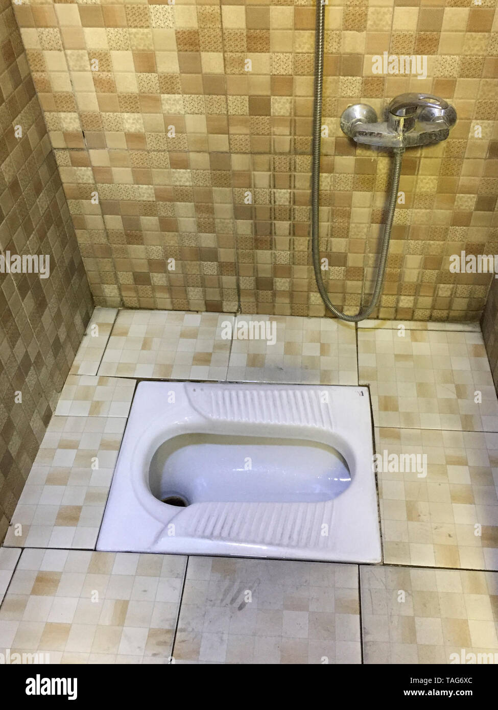 Asian Squat Toilet Shown in Tiled Restroom Stock Photo Alamy