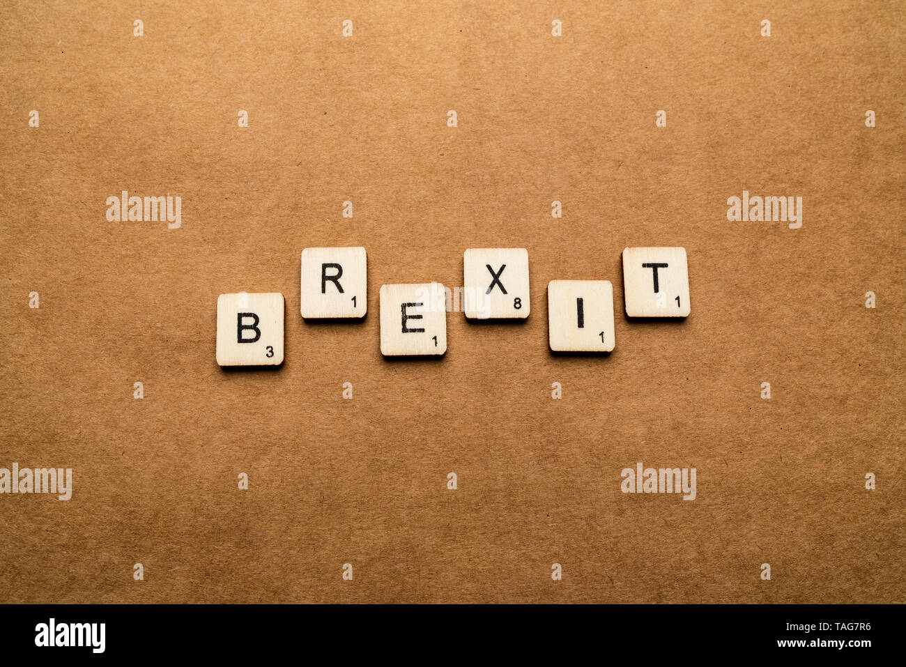 LONDON, UK - May 24 2019: The word BREXIT, spelt with wooden letter tiles over a brown textured background Stock Photo