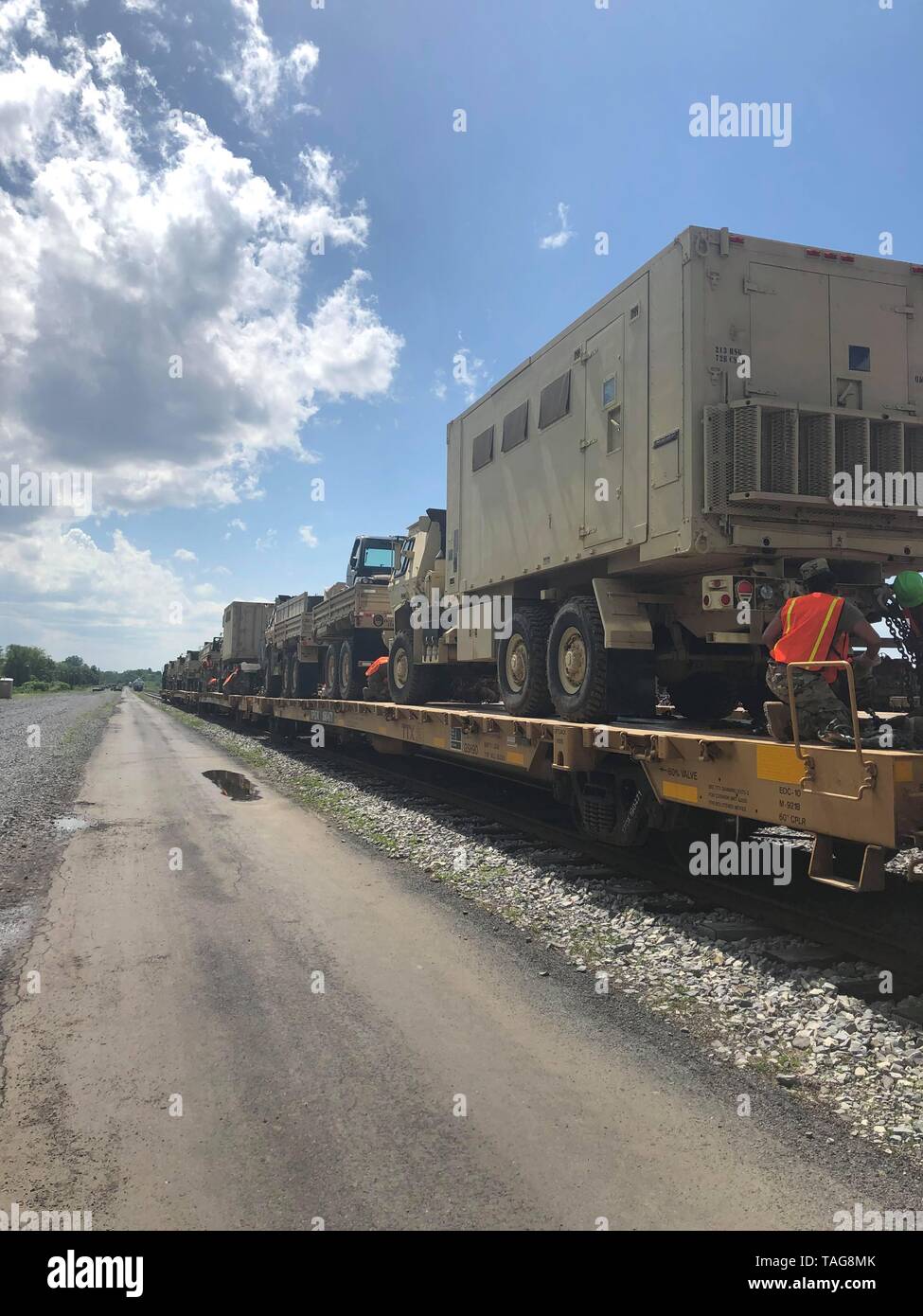 U.S. Soldiers with a rail operations task force, comprising Soldiers with the 28th Expeditionary Combat Aviation Brigade, 128th Chemical Company and 252nd Quartermaster Company, secure trucks aboard a train May 21, 2019, at Naval Support Activity Mechanicsburg, Pennsylvania. The task force loaded wheeled-vehicles and other equipment on to the train to be transported to the National Training Center at Fort Irwin, California in preparation for an exercise that will take place this summer. (U.S. Army photo by Chief Warrant Officer 2 Sara Christensen) Stock Photo