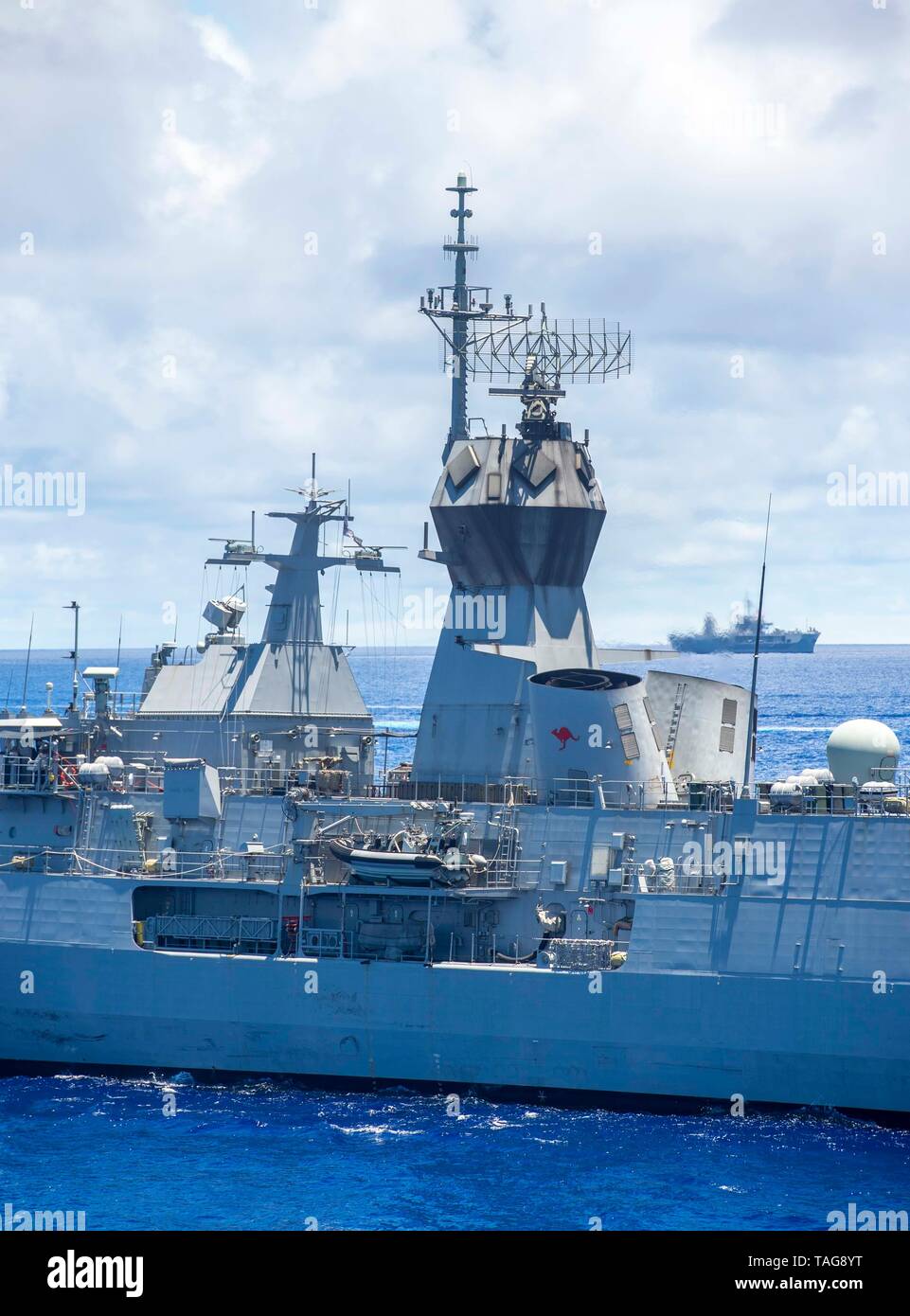 190524-N-XX999-0153 PHILIPPINE SEA (May 24, 2019) — Royal Australian Navy guided-missile frigate HMAS Parramatta (FFH 154) steams behind the ampibious command ship USS Blue Ridge (LCC 19) during Pacific Vanguard (PACVAN). PACVAN is the first of its kind quadrilateral exercise between Australia, Japan, Republic of Korea, and U.S. Naval forces. Focused on improving the capabilities of participating countries to respond together to crisis and contingencies in the region, PACVAN prepares the participating maritime forces to operate as an integrated, capable, and potent allied force ready to respon Stock Photo