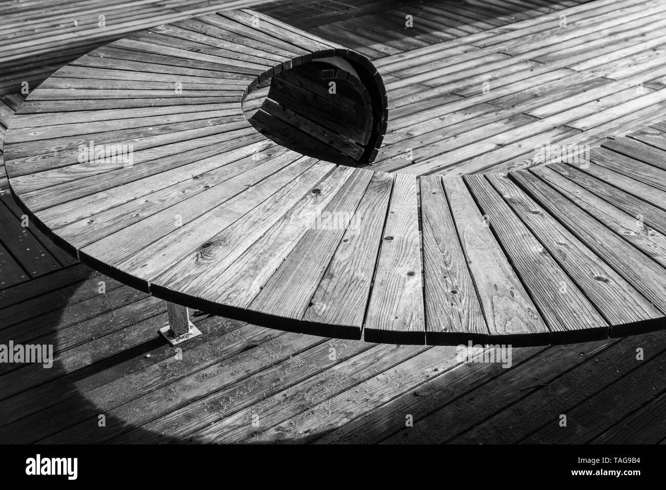 Black white image of modern geometric wooden construction intended as seating, Germany Stock Photo