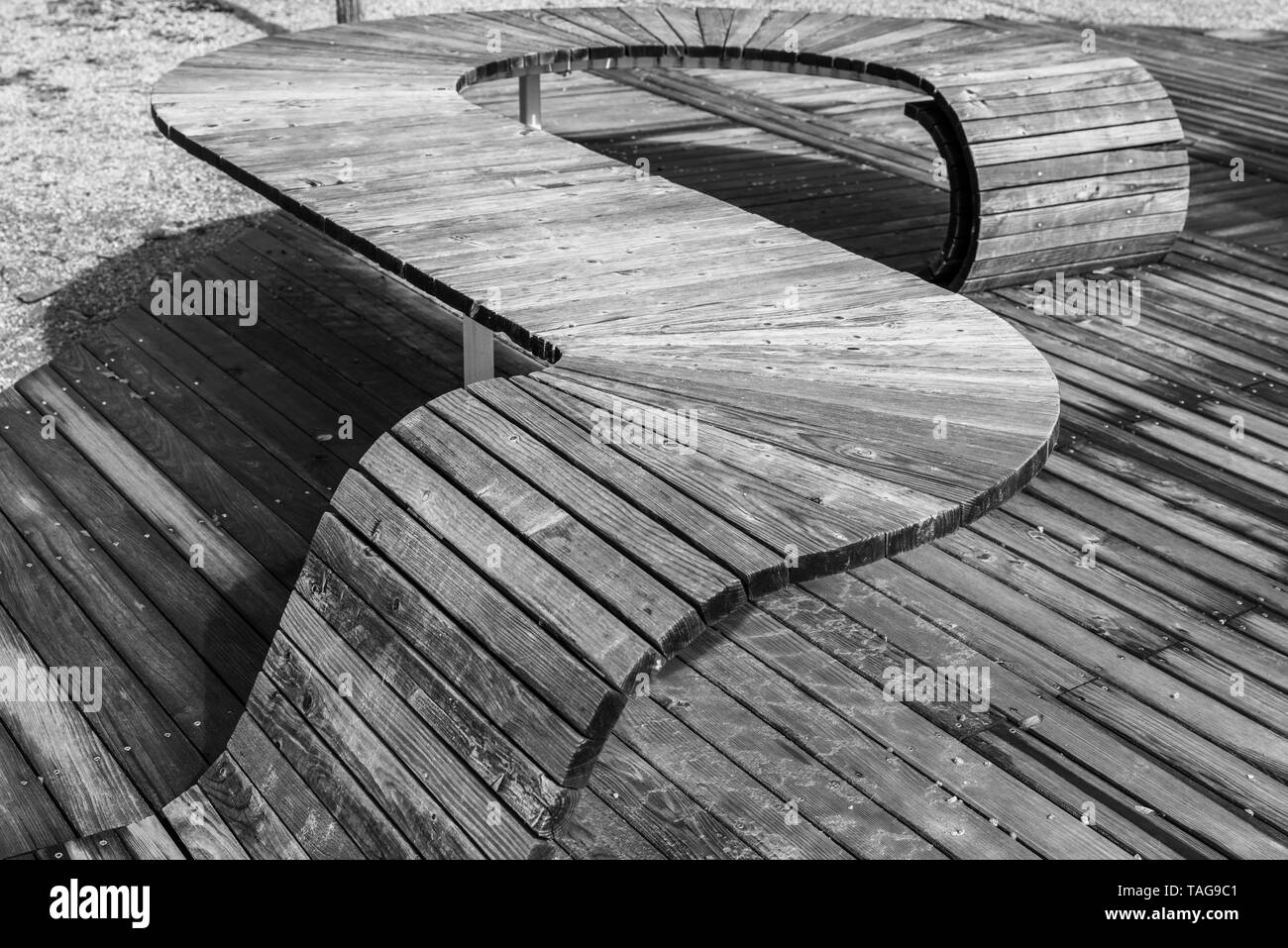 Black white image of modern geometric wooden construction intended as seating, Germany Stock Photo
