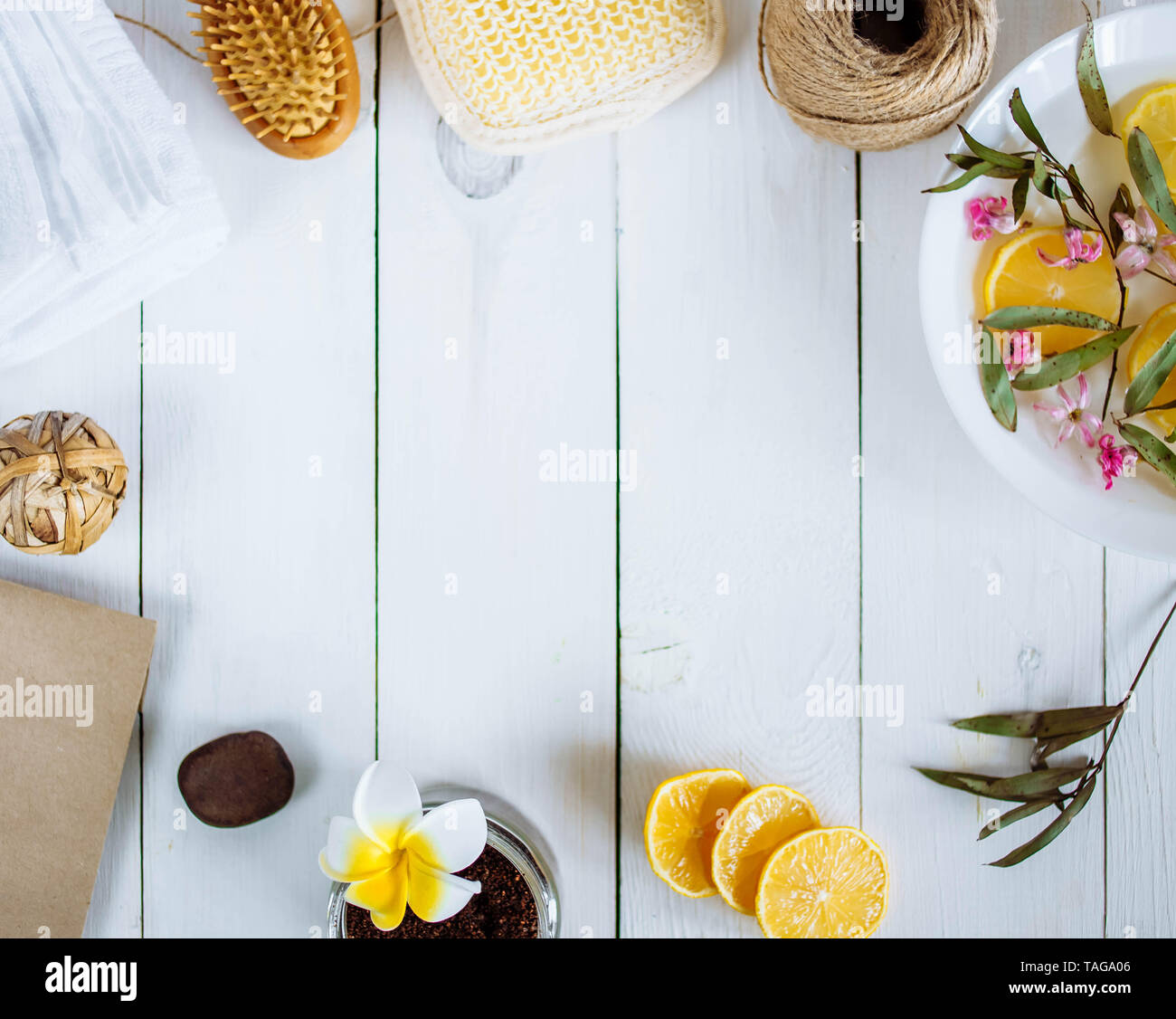 Homemade lemon essential oil, salt bath and fresh honey in the plate
