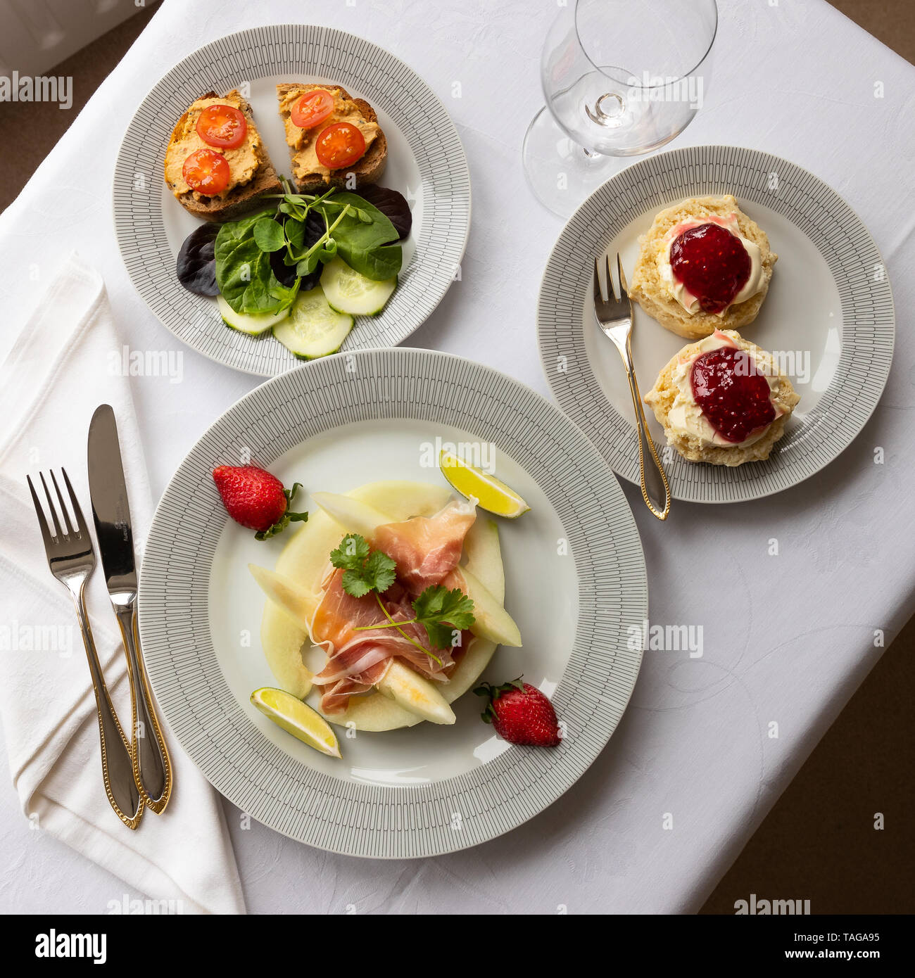 Mixed starters and desert on tablecloth Stock Photo