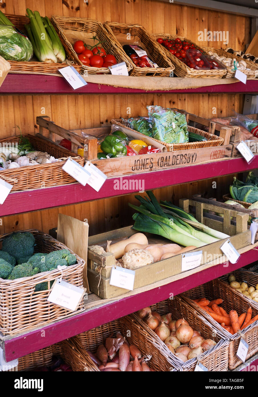 Outdoor Kiosk with shelves filled with fresh vegetables Stock Photo