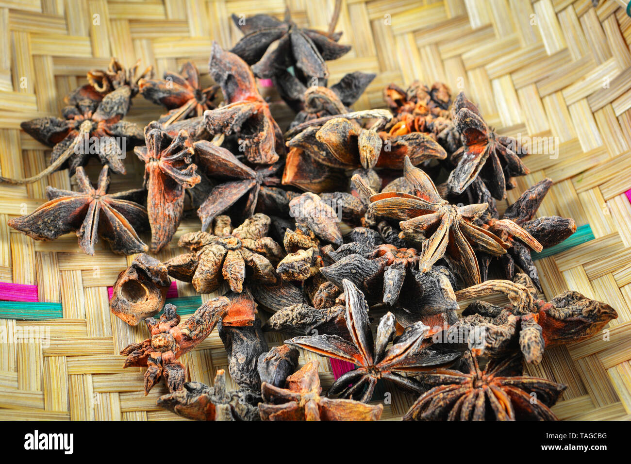 Chinese star anise spice fruit on bamboo basket close up Other names