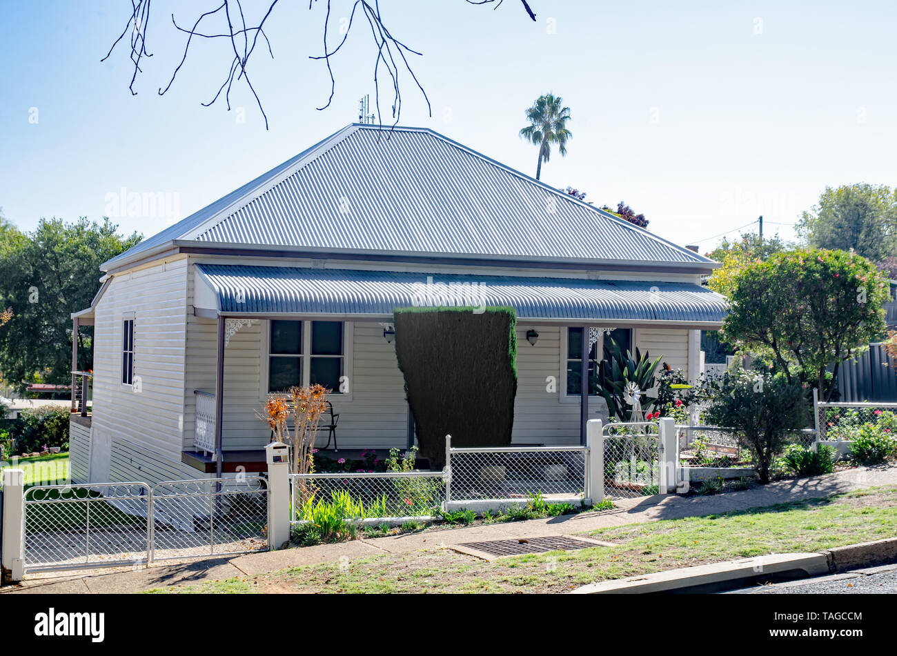An early 20th century Australian workers cottage with new iron roof. Stock Photo