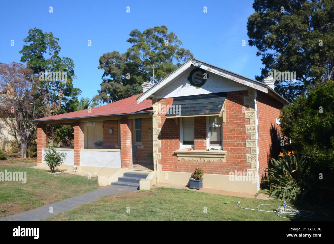 Australian 1920s brick Bungalow on a sunny Autumn day. Stock Photo