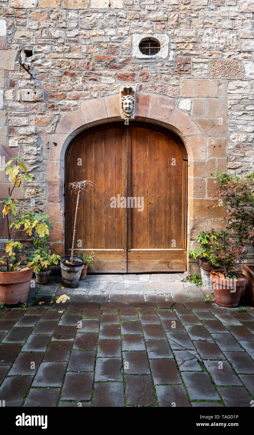 Beautiful wooden door and an old stone building Stock Photo - Alamy