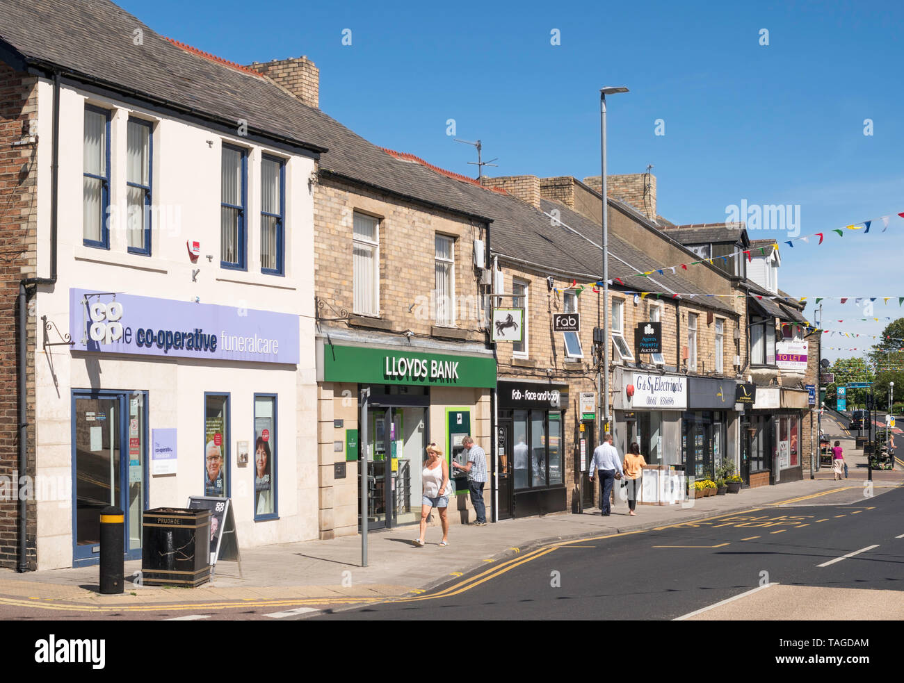 People walking along Front Street, Prudhoe town centre, Northumberland, England, UK Stock Photo