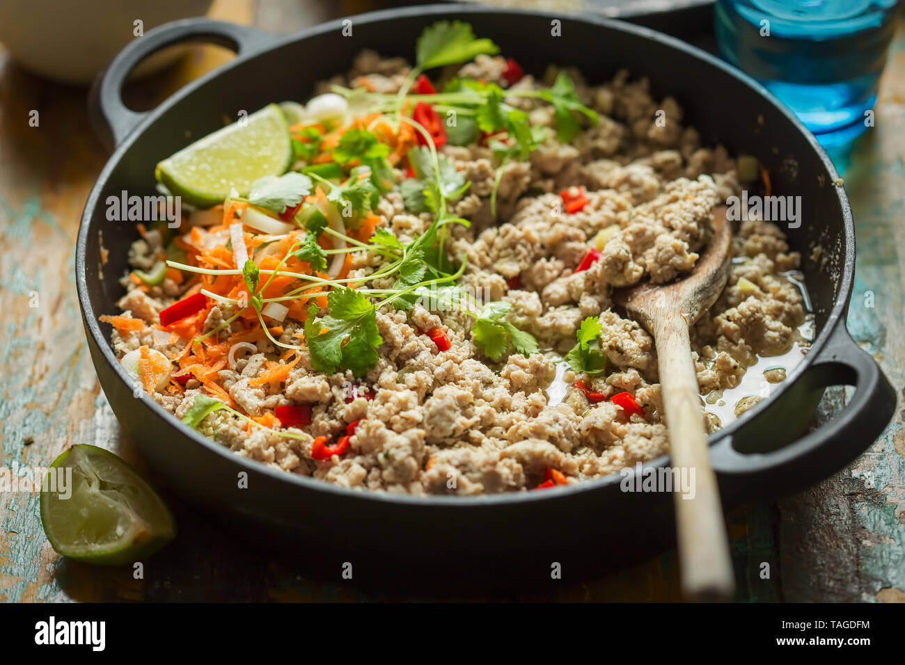 Chicken & pork larb with carrot, scallions and coriander Stock Photo