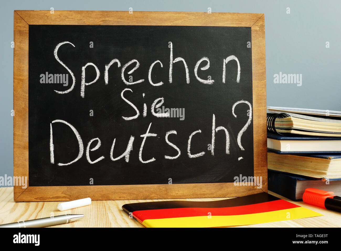 Sprechen Sie Deutsch written on a blackboard. Learn German concept. Stock Photo