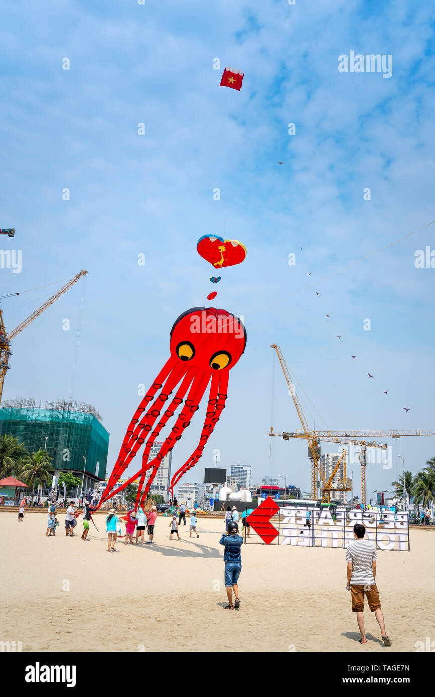 My Khe beach, Da Nang city, Vietnam - April 28, 2019: Kite flyers and tourists attend the annual kite flying festival at My Khe Beach, Da Nang City, VN Stock Photo