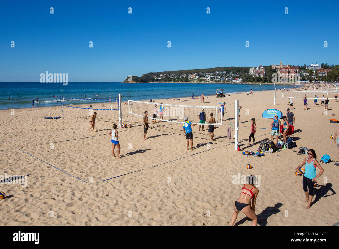 Men and women playing beach volleyball on the sands of Manly beach in Sydney,Australia, Manly beach has multiple volleyball courts on the sand Stock Photo