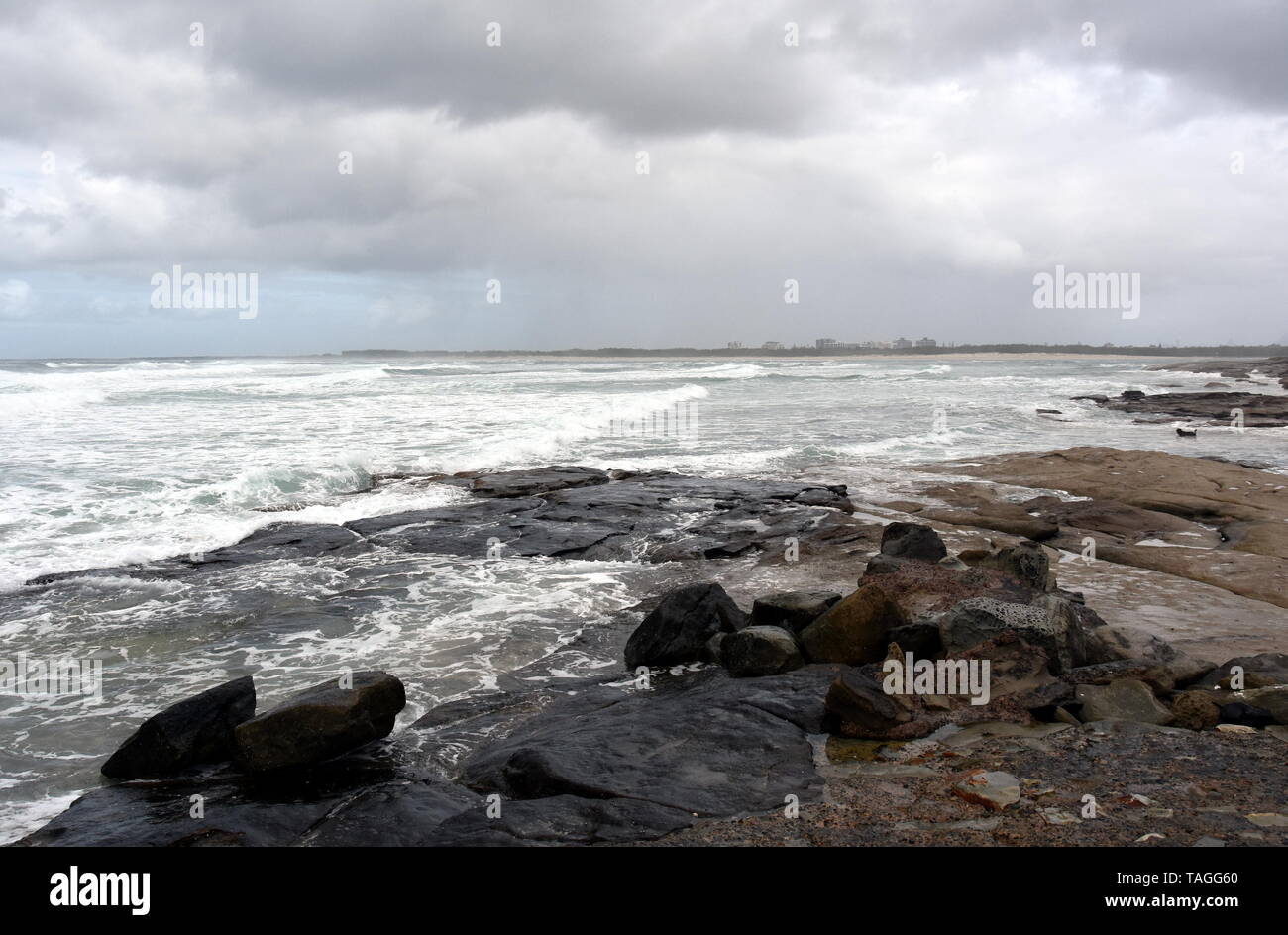 View of Bribie sandy Island from Kings beach on a stormy cloudy day (Caloundra, Sunshine Coast, Queensland, Australia). Stock Photo