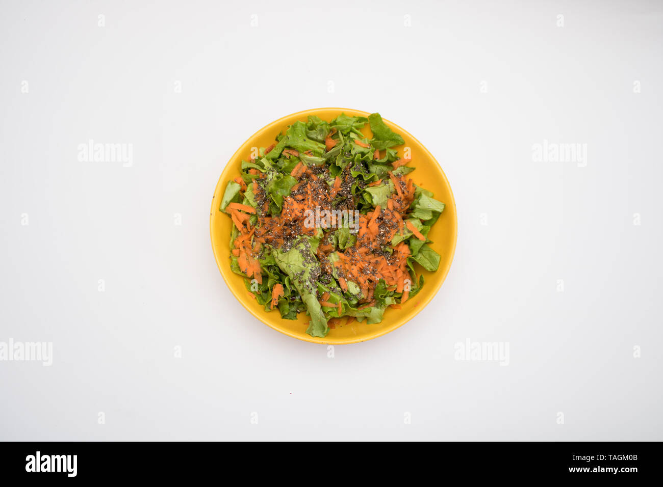 Simple salad with carrots and chia seeds for breaking a fast isolated