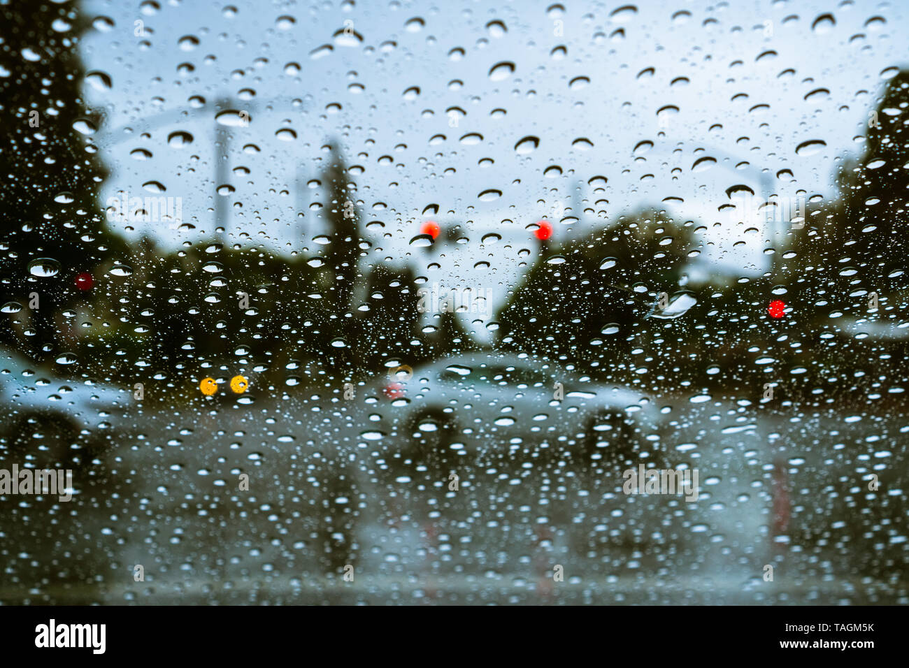 Cars driving through rain; raindrops on the windshield Stock Photo