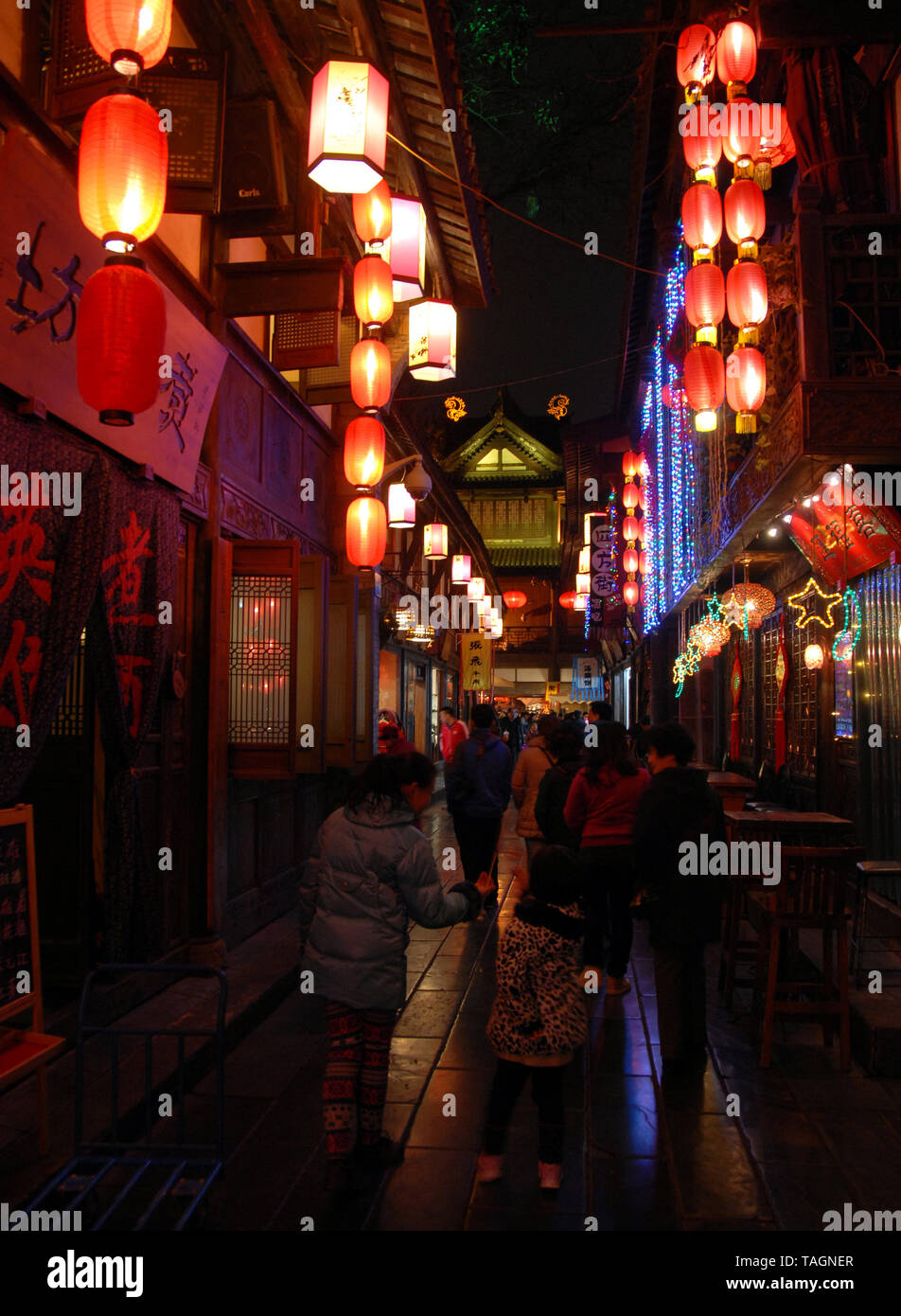 Jinli Ancient Street in Chengdu, China.  Jinli Street has cafes and bars and is decorated with red lanterns. It's a fun place at night in Chengdu. Stock Photo