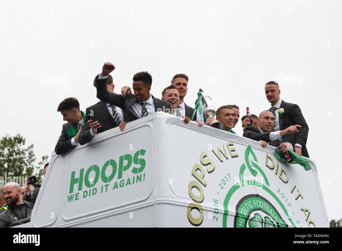 25th May, 2019. Glasgow, Scotland, UK, Europe. Scottish Cup winners, Celtic Football Club celebrate their achievement of three consecutive seasons of domestic trophy clean sweeps. The first time a domestic club has completed the triple treble in world football. Pictured are the club captain and players aboard and open top bus parade through the streets of Glasgow. Stock Photo