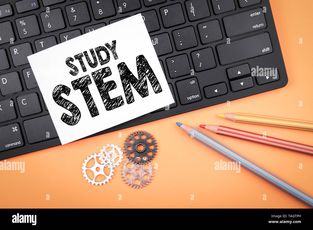 Study STEM. Computer keyboard, colored pencils and gear Stock Photo - Alamy