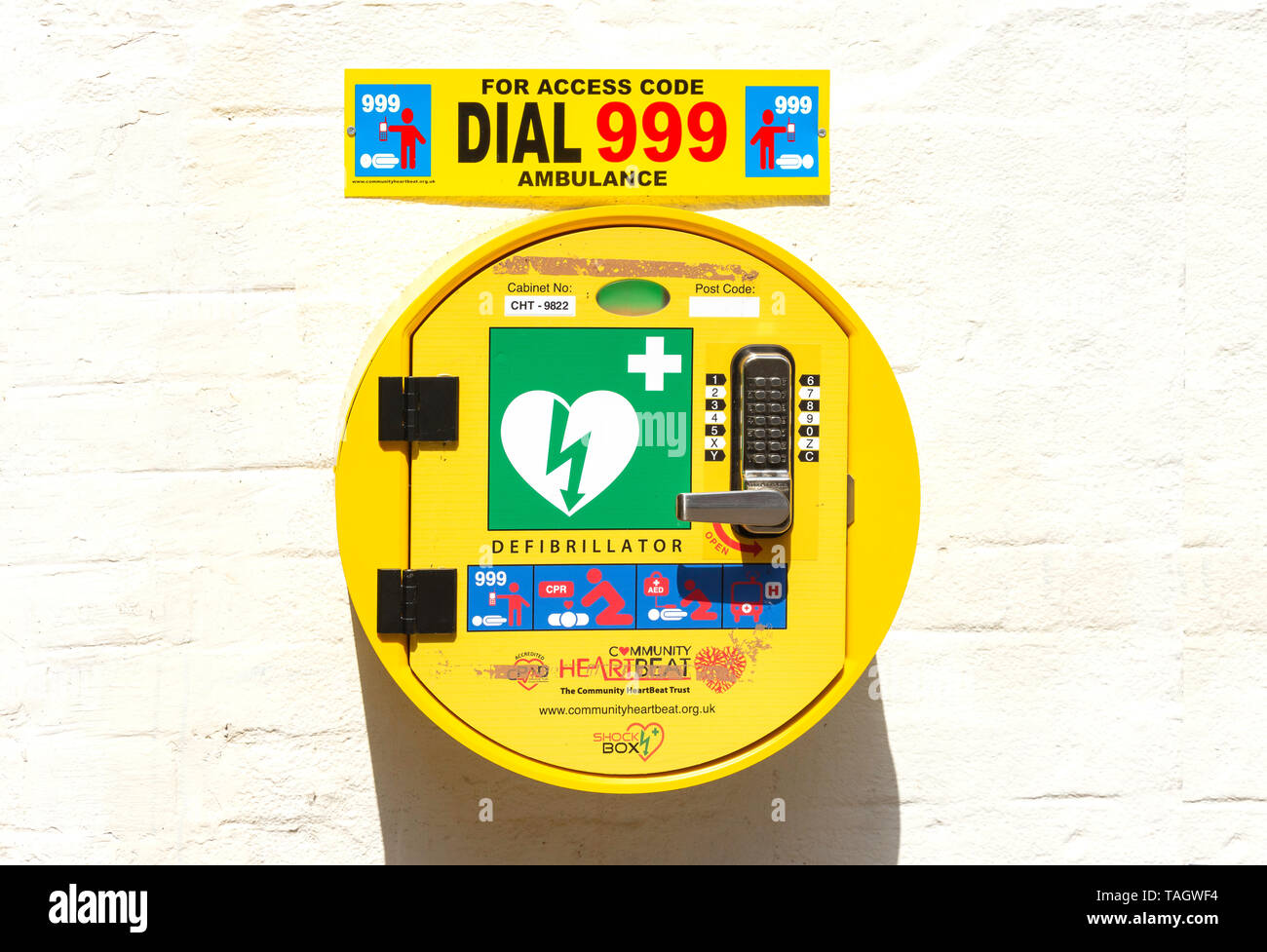 Public wall-mounted defibrillator in town centre, High Street, Banbury, Oxfordshire, England, United Kingdom Stock Photo