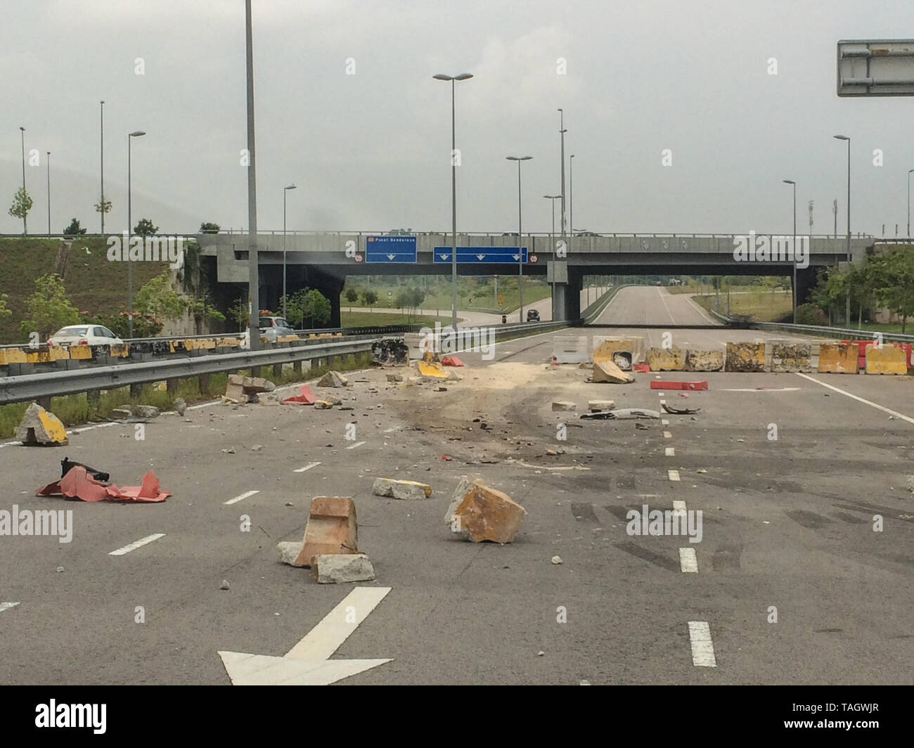 Concrete crash barrier destroyed after traffic accident Stock Photo