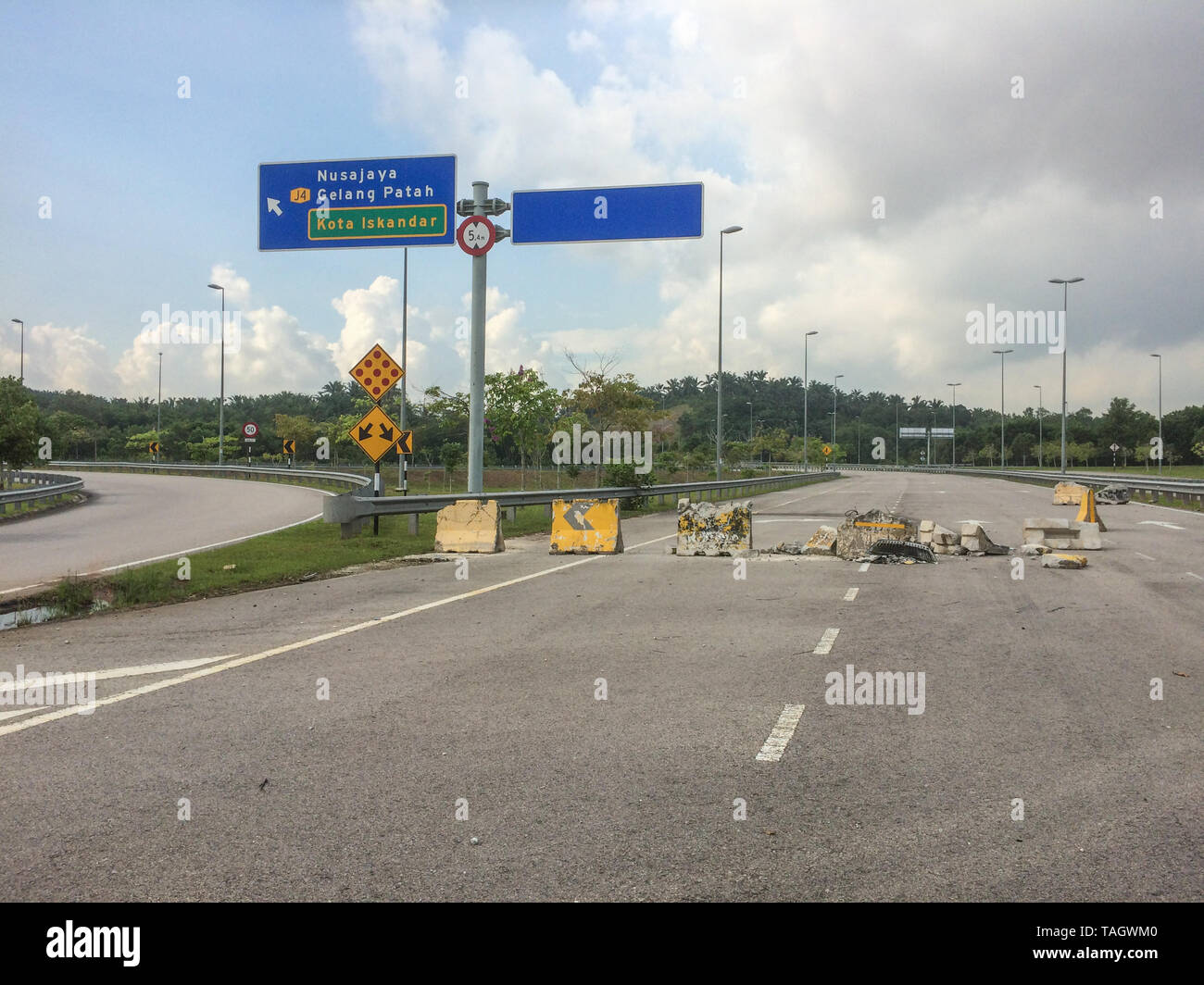 Concrete crash barrier destroyed after traffic accident Stock Photo