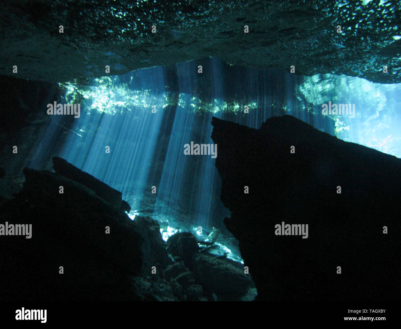 Reflection of light Underwater at cenote Chac Mool in the Riviera
