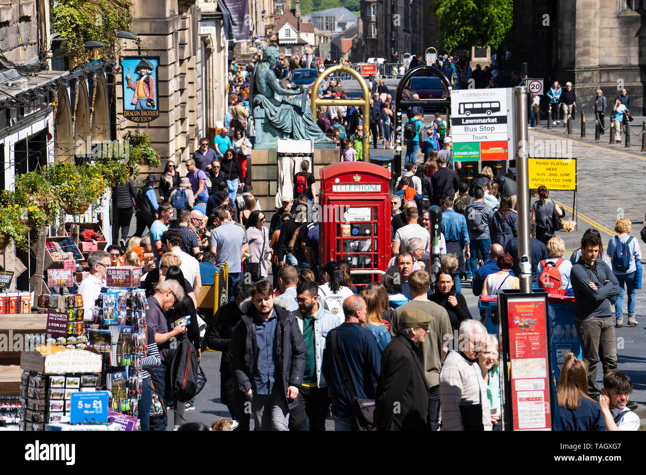 View of many tourists crowded on street at Royal Mile at Lawnmarket in Edinburgh Old Town, Scotland, UK Stock Photo