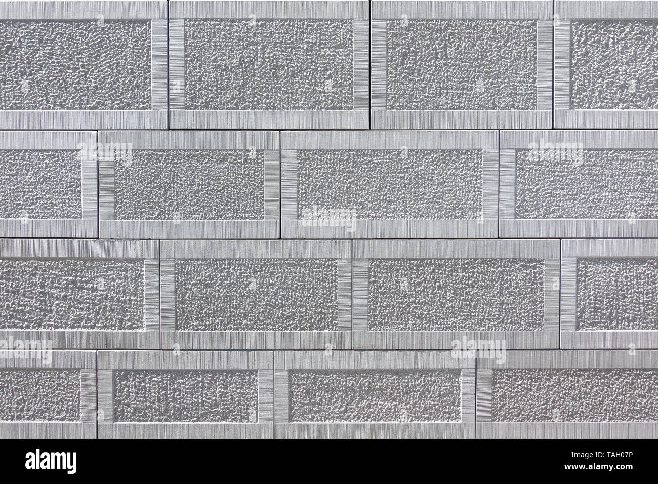 Detail of a wall of gray square sandstone with pattern Stock Photo