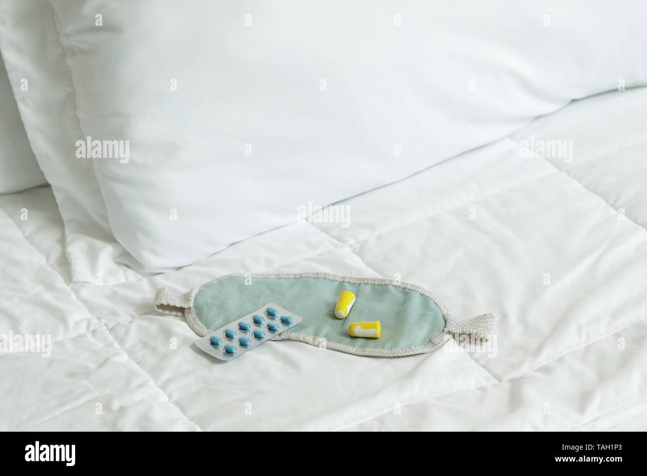 Image showcasing Concept of insomnia - earplugs, blindfold and sleeping pills Stock ...